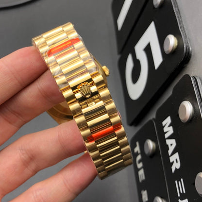 Rolex Oyster Perpetual Day-Date Yellow Gold And Fluted Bezel